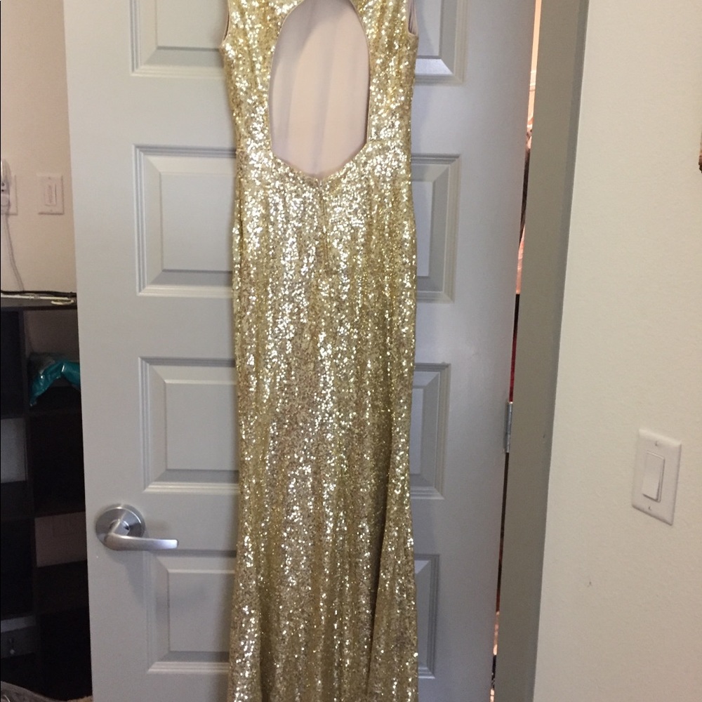 Floor length gold sequined mermaid gown